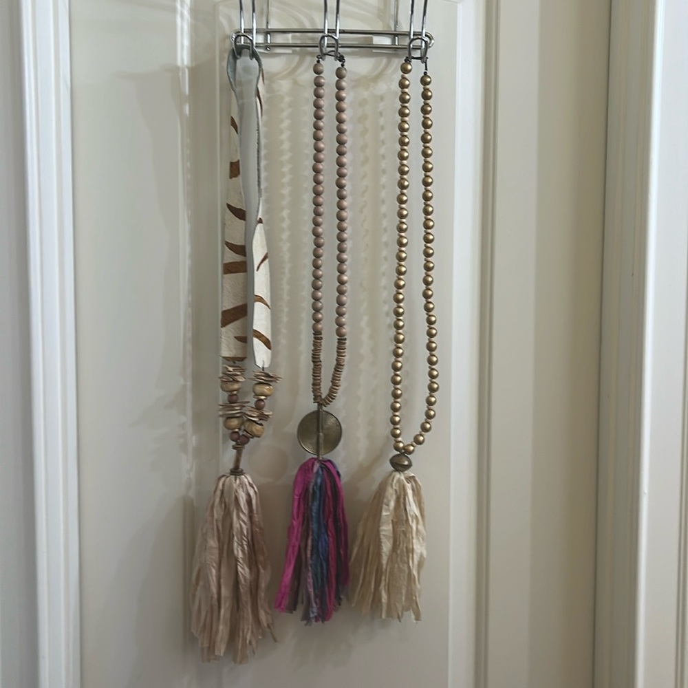 Three custom made long necklaces.